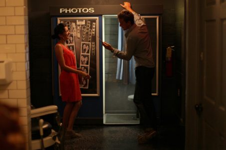 Couple looking at photos from a photobooth