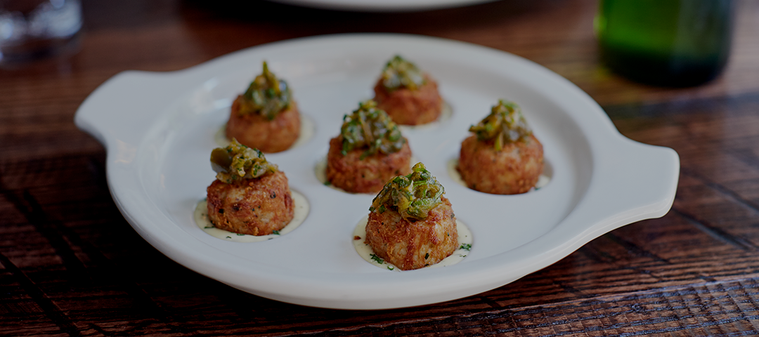 Background photo of crab cakes on a plate