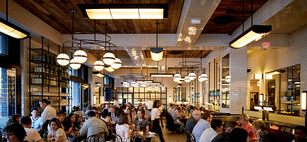 An interior photo of The Smith Penn Quarters dining room filled with guests